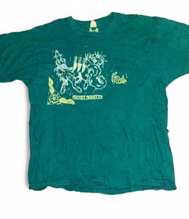 KNIVES OUT on blue tee