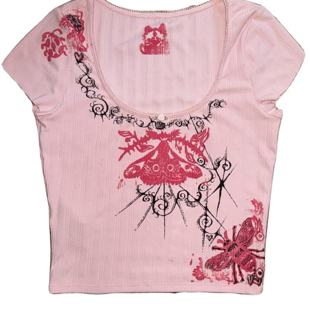 Hand-drawn details on pink ribbed top
