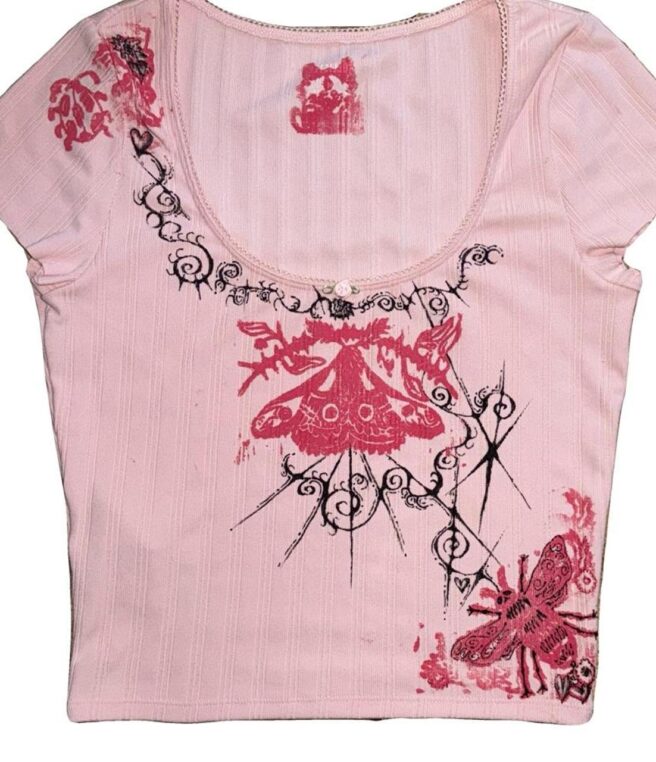 Hand-drawn details on pink ribbed top